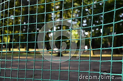 Public multifunctional city playground with tartan surface in the park is used to play basketball football floorball goals baskets Stock Photo