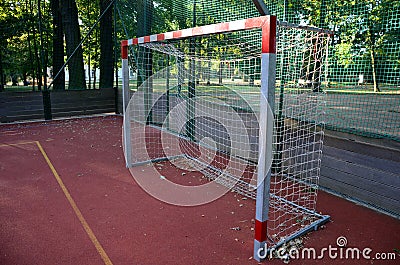 Public multifunctional city playground with tartan surface in the park is used to play basketball football floorball goals baskets Stock Photo