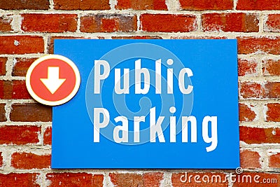 Public Parking Sign on Red Brick Stock Photo