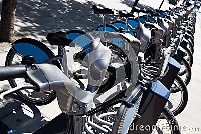 Public Rental Bicycles in a Line, London, UK Stock Photo