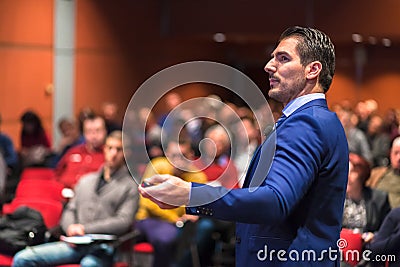 Public speaker giving talk at Business Event. Stock Photo