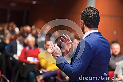 Public speaker giving talk at Business Event. Stock Photo