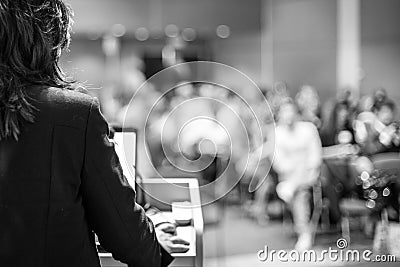 Public speaker giving talk at Business Event. Stock Photo