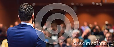 Public speaker giving talk at Business Event. Stock Photo