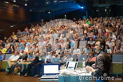 Public speaker giving talk at Business Event. Stock Photo