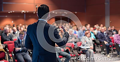 Public speaker giving talk at business event. Stock Photo