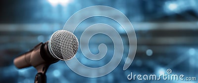 Public speaking backgrounds, Close-up the microphone on stand for speaker speech at seminar room Stock Photo