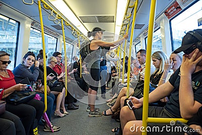 Public transport commuters in train Editorial Stock Photo