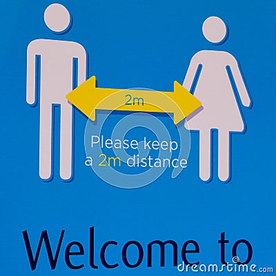 Public Warning sign Advicing People To Keep 2m Apart During Covid-19 Editorial Stock Photo