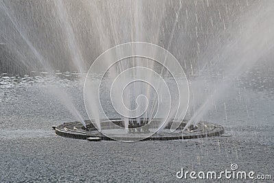A public water fountain spray structure giving out enormous jets of water Stock Photo