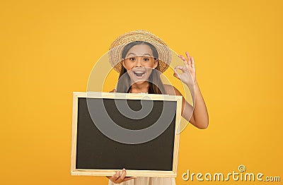 Publicity and education. Happy child give ok sign. Little kid hold blank blackboard. School publicity. Advertising and Stock Photo