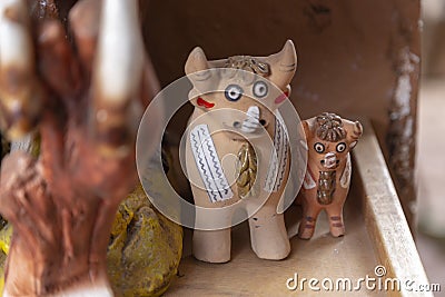 The Pucara bulls are placed on the roofs of houses. Crafts, Peru Stock Photo