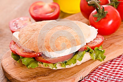 Puccia bread with mozzarella and tomato. Stock Photo