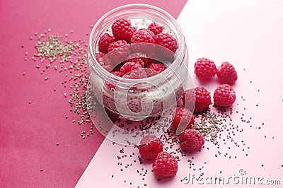 Pudding chia with coconut milk and raspberries on the pink background. Healthy and diet food. Vegan food Stock Photo