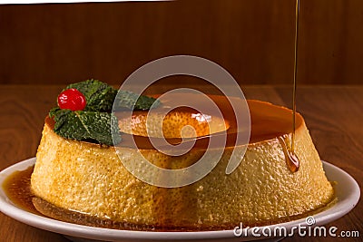 Pudim de leite, a delicious Brazilian flan dessert, with milk and condensed milk, topped with caramel sauce. It`s type of vanill Stock Photo