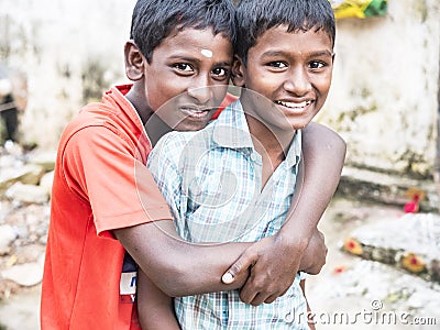 Unidentified best children boys friends smiling standing with hand on shoulder enjoying friendship Editorial Stock Photo