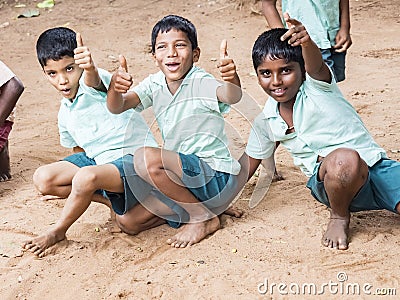Happy best children friends boys classmates smiling showing thumb up gesture at the school. Multiethnic school kids enjoying Editorial Stock Photo
