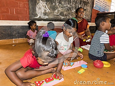 Interior of poor kids playing government room. Children`s entertainment, recreation, sports, educational games indoor Editorial Stock Photo