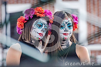 Puebla, Mexico - October 31, 2018. Girls with skull painted face Editorial Stock Photo