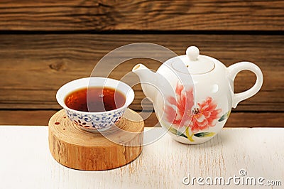 Puerh tea in white bowl brewed in white porcelain pot Stock Photo
