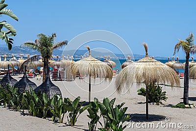 PUERTO BANUS ANDALUCIA/SPAIN - MAY 26 : Sun Umbrellas on the Beach at Puerto Banus Spain on May 26, 2016 Editorial Stock Photo