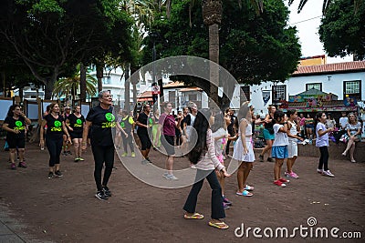 Group Zumba fitness dance class in the public city park Parque Plaza Del Charco Editorial Stock Photo