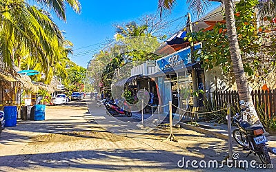 Colorful tourist street people stores restaurants bar La Punta Zicatela Editorial Stock Photo