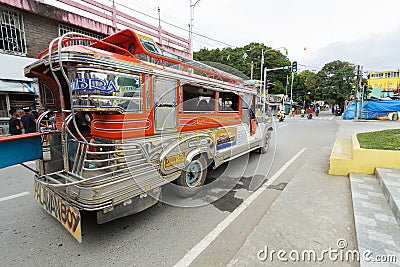 Puerto Galera, Philippines - January 9, 2017: Jeepney staying to pick up passengers, crossroad, day time Editorial Stock Photo