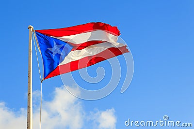 Puerto Rican flag against a blue sky Stock Photo