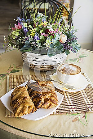 Puff buns and delicious cappucino Stock Photo