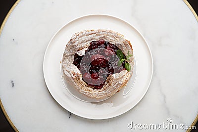 Puff pastry cake with berries on wooden background Stock Photo