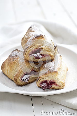 Puff Pastry Cherry Turnovers on desk Stock Photo