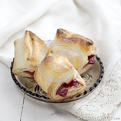 Puff Pastry Cherry Turnovers on desk Stock Photo