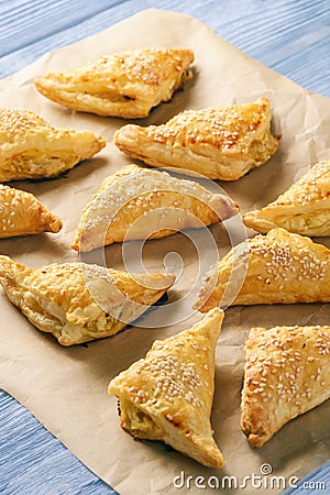 Puff pastry triangles filled with feta cheese and leek. Stock Photo