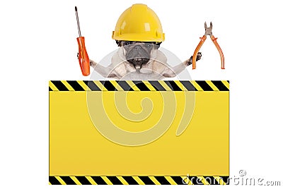 Pug dog holding pliers and screwdriver behind yellow warning sign Stock Photo