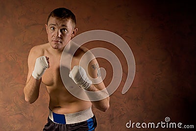 Pugnacious determined young boxer Stock Photo