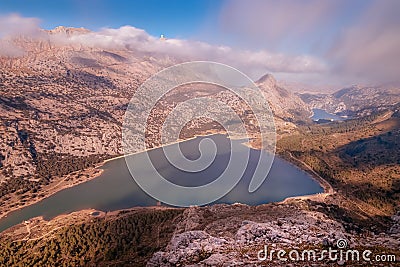 Puig Major with Cuber and Gorg Blau reservoirs, sun and blue skies with low white clouds, Tramuntana, Mallorca, Spain Stock Photo