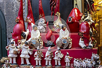 Pulcinella lucky charm and red horns at the souvenir shop in Naples Stock Photo