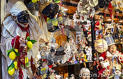 Pulcinella lucky charm and red horns at the souvenir shop in Naples Editorial Stock Photo