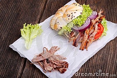 Pulled pork burger with coleslaw tomato, onion and fresh bread. Stock Photo