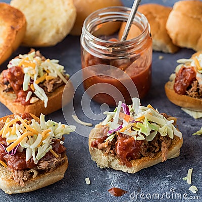 Pulled pork sliders with homemade tangy barbecue sauce. Square crop. Stock Photo
