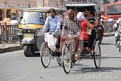 Pulling a Rickshaw in heat Editorial Stock Photo