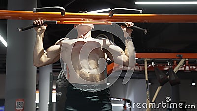 Pullup. Muscular Athlete Practicing Pullup in Sport Gym. Athlete Do