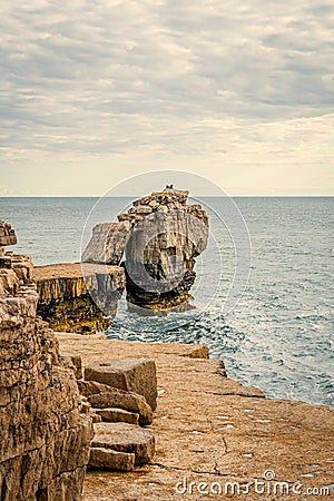 Pulpit rock on Isle of Portland on Dorset coastline at sunset Stock Photo