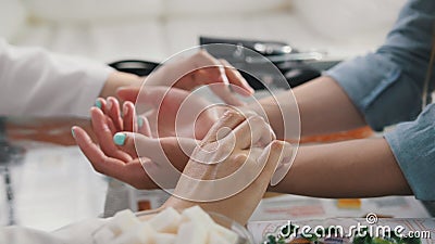 Pulse diagnostic with hand on a tibetan medicine Stock Photo