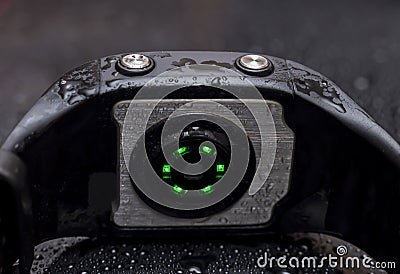 Pulsometer watch wet in water on black background Stock Photo