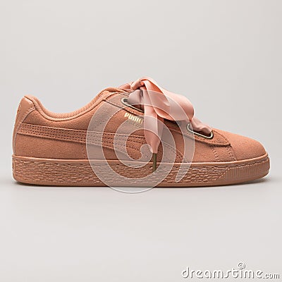 Puma Suede Heart Satin coral and gold sneaker Editorial Stock Photo