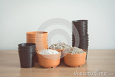 Pumice pebbles in cray pot and gardening tool Stock Photo