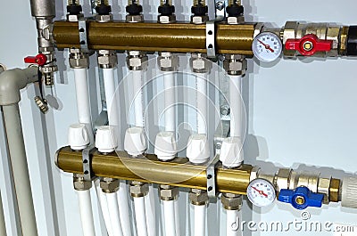 Pump with a thermometer for a water underfloor heating system at home. Servo, sensors and temperature control. Heating systems Stock Photo