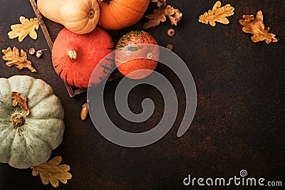 Pumpkin. Autumn food background with cinnamon, nuts and seasonal spices on brawn rustic background. Cooking pumpkin or apple pie a Stock Photo
